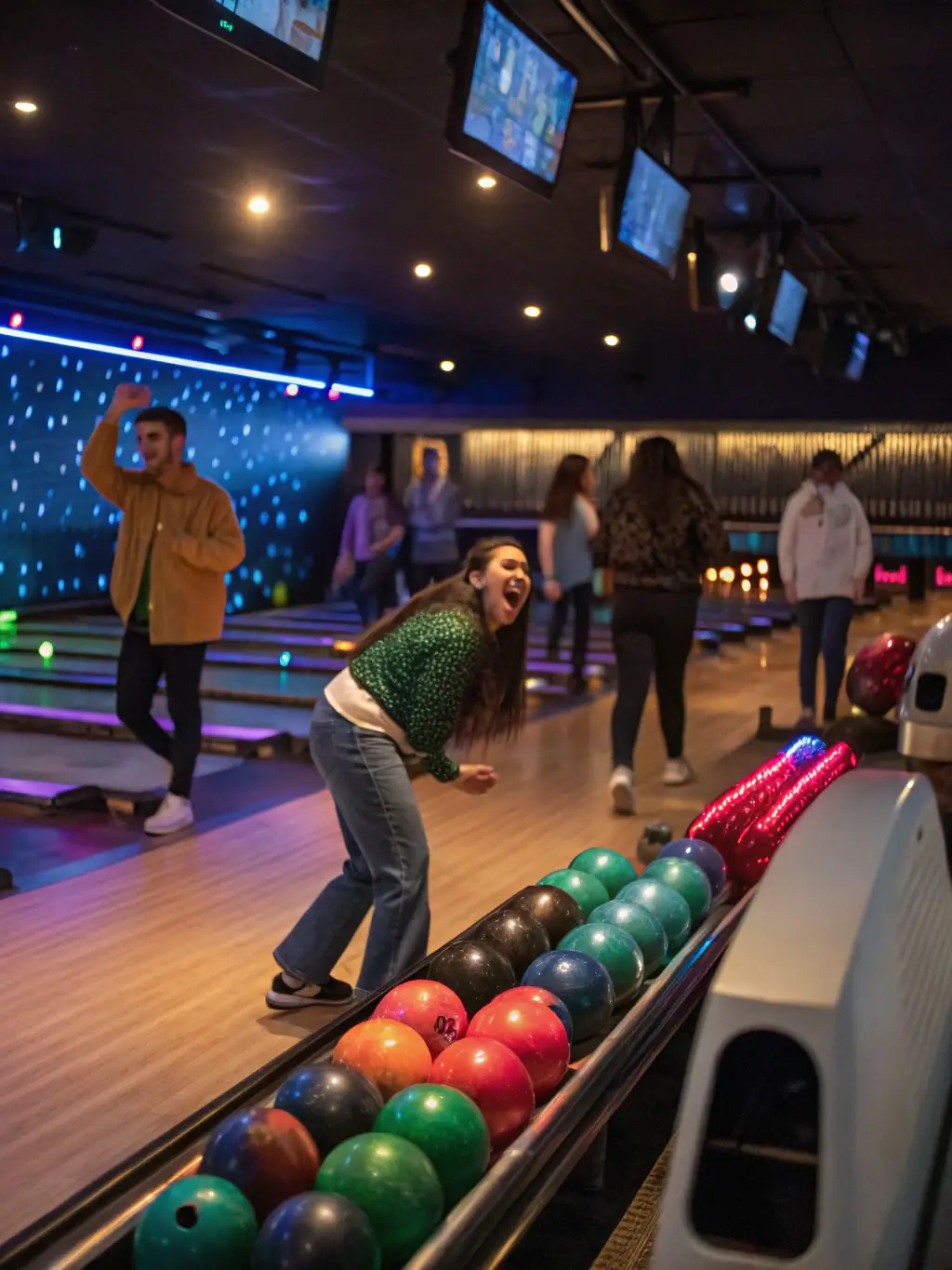 A brightly lit, modern bowling lane with a group of friends laughing and enjoying a game at CB BOWLING ApS.