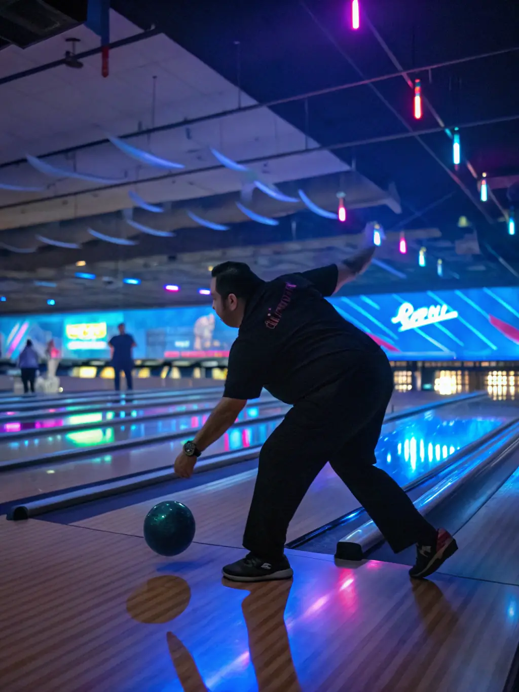 A close-up shot of a bowling ball striking pins, with a focus on the impact and scattering pins at CB BOWLING ApS.